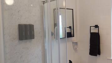 Shower, hair dryer, towels, soap