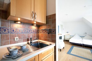 Køleskab, kogeplade, kaffe-/temaskine, elkedel