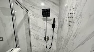 Shower, hair dryer, towels, soap