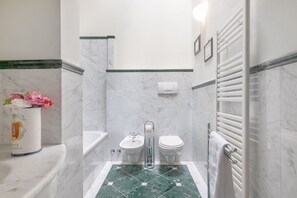 Bathtub, hair dryer, towels