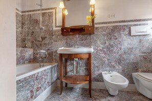 Bathtub, hair dryer, towels