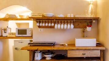 Fridge, microwave, stovetop, coffee/tea maker