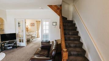 TV, fireplace, books, offices