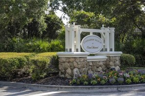 Welcome to Cinnamon Beach at Grand Bahama, where lush gardens surround a beautifully designed entrance.