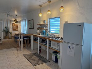 Fridge, microwave, stovetop, coffee/tea maker