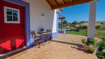 Deluxe Room, Pool View | Terrace/patio