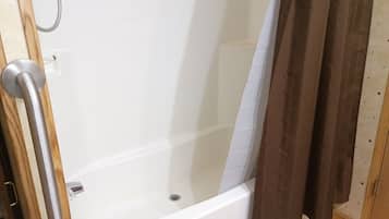 Combined shower/tub, hair dryer, towels, soap