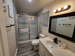 Bathtub, hair dryer, towels, soap