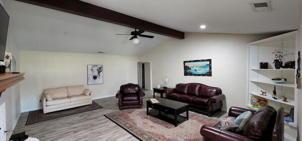 Smart TV, fireplace, table football, books