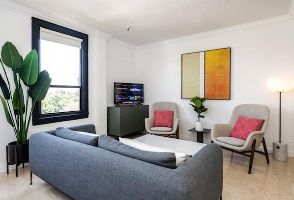 Studio layout with sofa and king bed