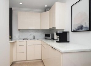 Modern kitchenette with coffee maker
