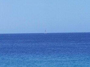 A sailboat on a calm sea.