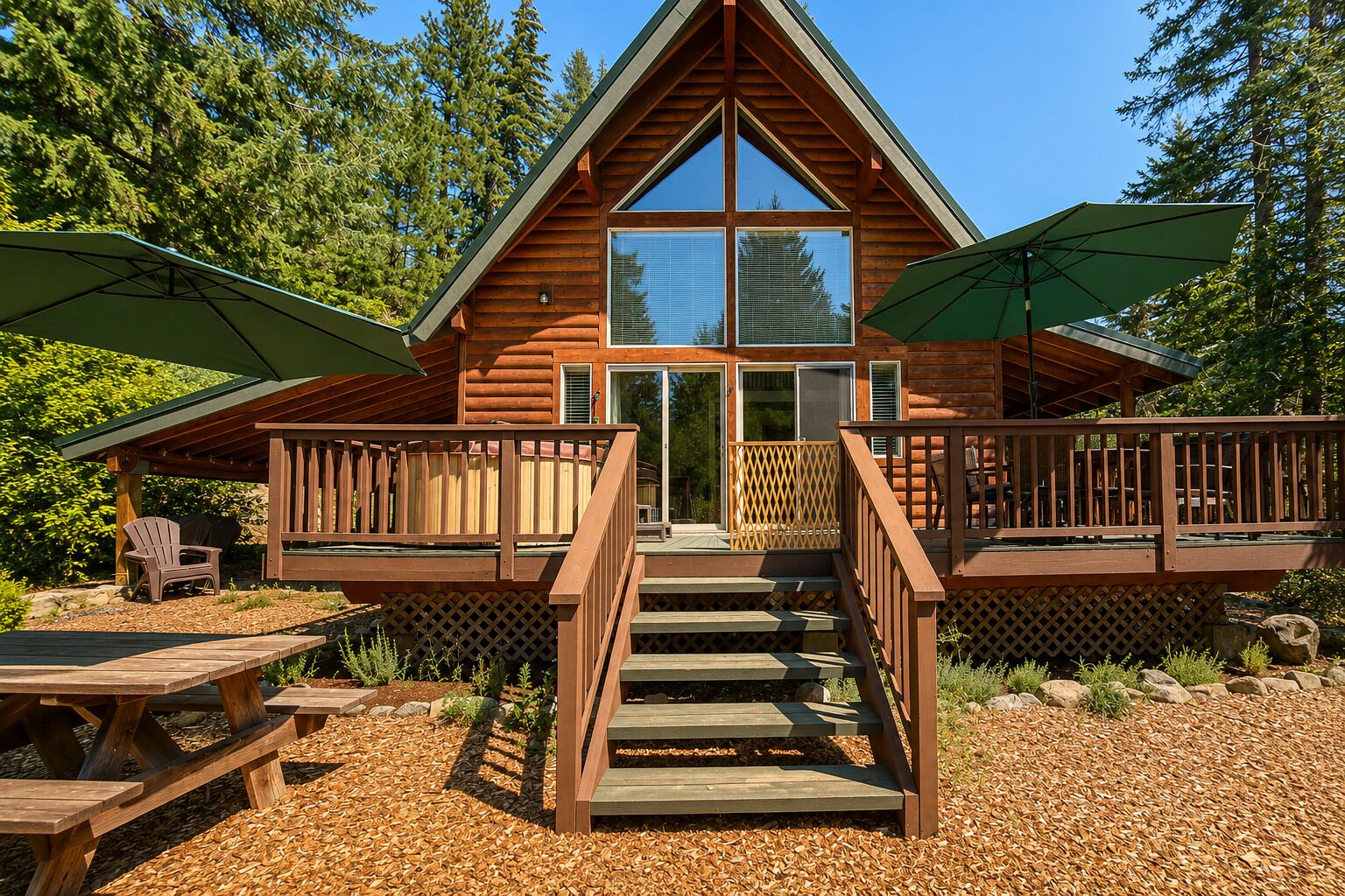 A cabin with a central staircase, wooden deck, and outdoor seating area.