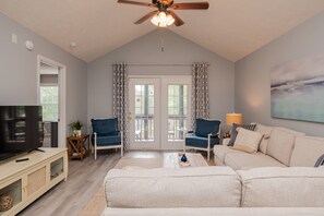 Flat-screen TV, DVD player, video library