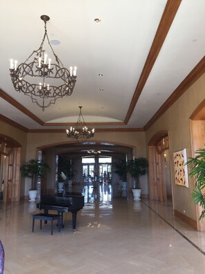 A spacious lobby with a grand chandelier, a grand piano, and potted plants. - Four Seasons Residence Club Aviara - 3792/week of 10/9-16 (Carlsbad)
