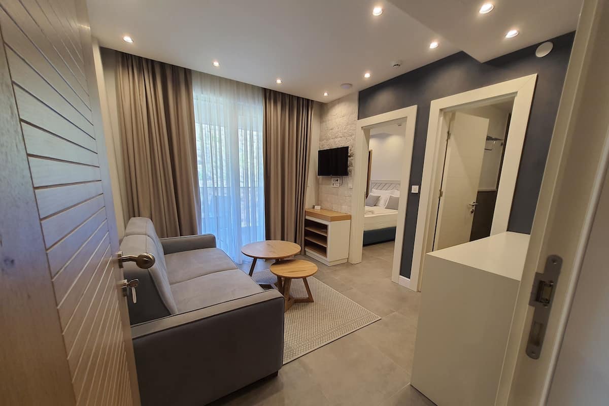 Superior Apartment, 1 Queen Bed with Sofa bed | Living area | 32-inch LCD TV with cable channels, TV