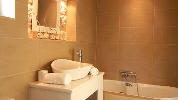 Combined shower/tub, hair dryer, towels, soap