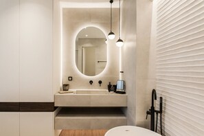 A modern bathroom with a large mirror, a sink, and a toilet. - 5BD Luxury Penthouse with Sea View (Glyfada)