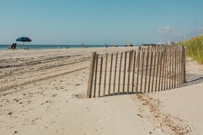 Enjoy a day of relaxation on this public beach with access to amenities and activities.