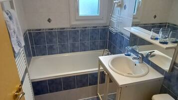 Bathtub, hair dryer, towels