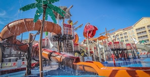 A water park with various water slides and play structures.