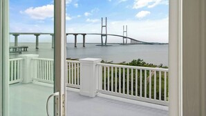 A balcony with a view of a bridge over water. - ☀️Picturesque Views💥Game room👙Pool & Hot Tub (Brunswick)