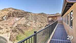 A balcony with a view of a rocky landscape. - New!!! Amazing river and mountain deck view home!!!! (Parker)