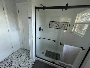 Shower, towels, soap, shampoo