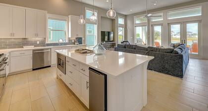 Modern, waterfront home with private pool, dock, balconies, central AC, and WiFi