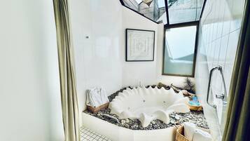 Bathtub, hair dryer, towels, soap