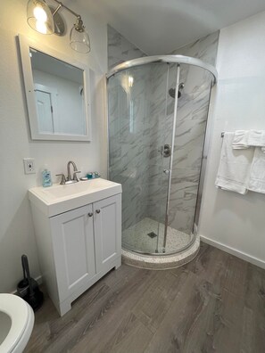 Shower, hair dryer, towels, soap