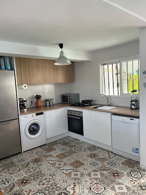 Coffee/tea maker, fridge, microwave, oven