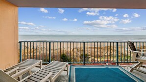 A balcony with a view of the beach and ocean. - DAILY ACTIVITIES & LINENS INCLUDED*! CAPRI - 3BR Direct Oceanfront Updated Condo! (Ocean City)