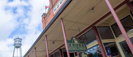 A brick building with a sign for H.P. Gruene Antique Company.