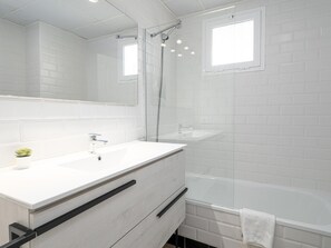 Bathtub, hair dryer, towels
