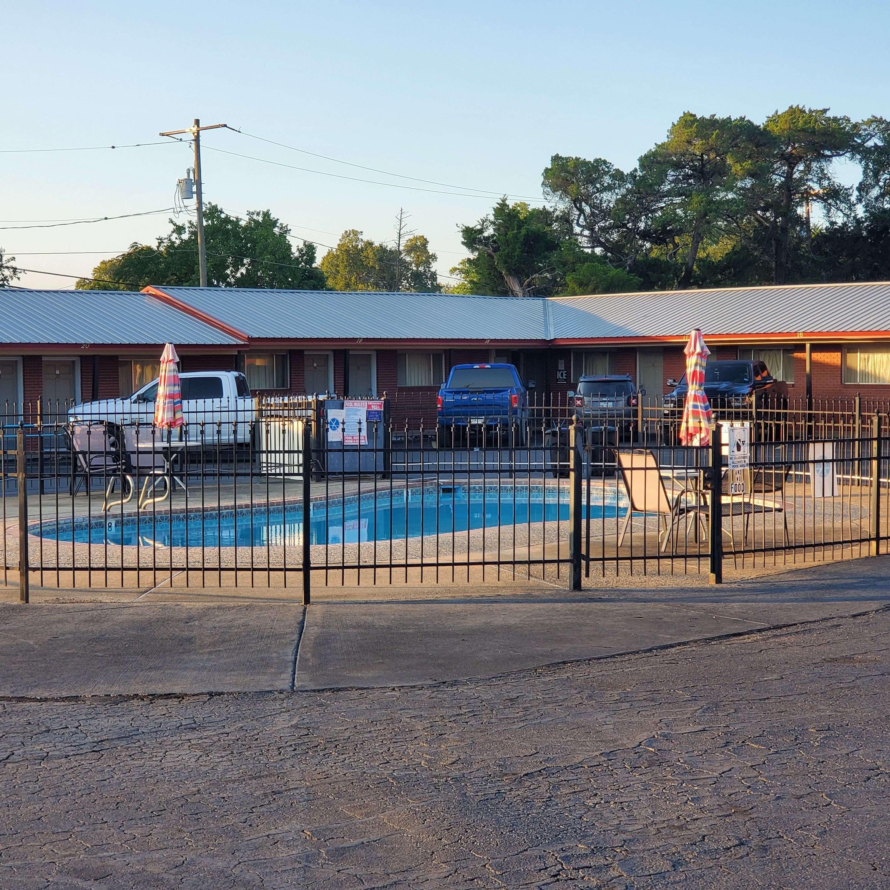 Seasonal outdoor pool, open 11:00 AM to 7:00 PM, pool umbrellas