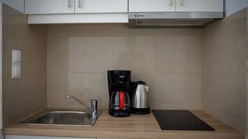 Fridge, coffee/tea maker, electric kettle, cookware/dishes/utensils