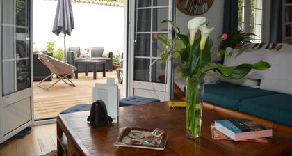Lovely house in quiet location between beach and town center; gardens, patio, parking.