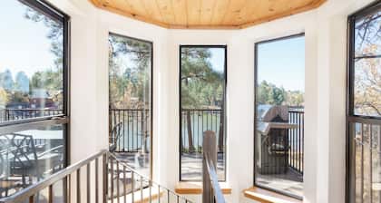 Luxury Waterfront Cabin at Rainbow Lake w/AC, Hot Tub, Game Room, Dock & Kayaks