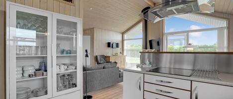 Fridge, stovetop, dishwasher, coffee/tea maker