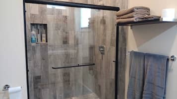 Shower, towels, soap, toilet paper