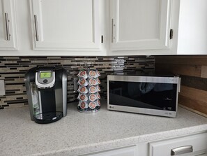 Enjoy cooking and brewing in this well-equipped kitchen with a coffee maker and microwave.