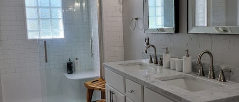 Combined shower/tub, hair dryer, towels, soap