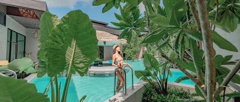 2 outdoor pools, open 7:00 AM to 9:00 PM, pool umbrellas, pool loungers