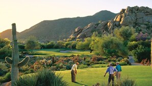 A golf course with cacti and a mountainous backdrop. - Scottsdale - Boho Cactus Condo - Newly Renovated! (Paradise Valley)