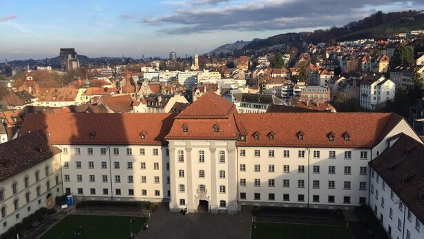 A large, historic building with a symmetrical facade, multiple windows, and a central courtyard. - Casa Schilling 2,5 Rooms in St Gallen, Modern, Quiet and Close to the Center (St. Gallen)