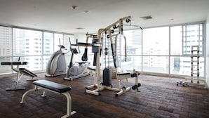 A gym with exercise equipment, a treadmill, and a bench. - 2B - 2 Bedrooms and 2 Bathrooms Located Downtown Apartment With Shared Pool (Bangkok)