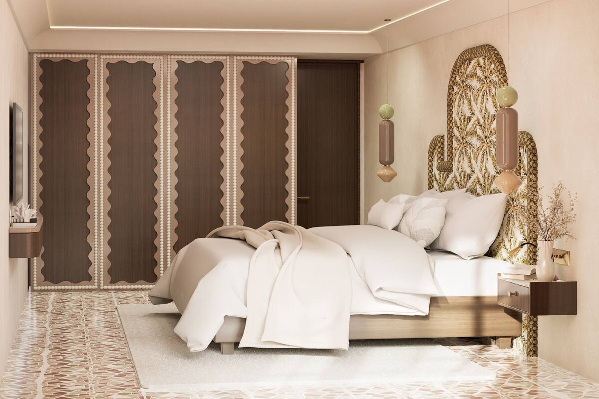 A bedroom with a bed, a nightstand, a wall-mounted lamp, and a decorative wall panel.