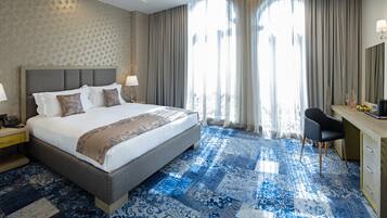 Superior Double Room | Minibar, in-room safe, desk, blackout drapes