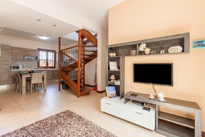 Family House, Multiple Bedrooms, 2 Bathrooms (Getaway Npetto Gozitan Villa) | Living area | 21-inch Smart TV with cable channels - Getaway Npetto Gozitan Villa (Ghajnsielem)
